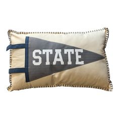 a pillow with the word state printed on it