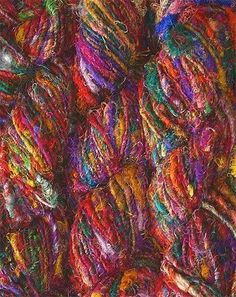 many balls of yarn are piled together