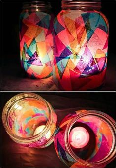 two jars that have candles in them and one is decorated with colorful paper machs