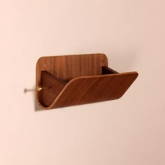 a wooden object hanging on the wall