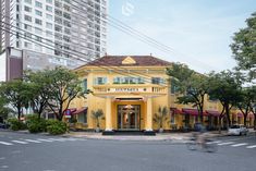 a yellow building on the corner of a street