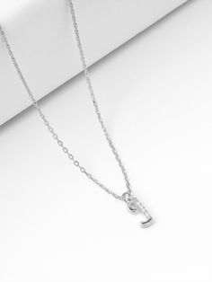 Introducing our Sterling Silver Letter Necklace, a delicate expression of personal style. This Tiny Initial Necklace features the letter "J," elegantly crafted to adorn your neckline with subtle charm. Plated in lustrous gold, this Dainty Initial Necklace adds a touch of sophistication to any outfit. Embrace individuality with this Small Monogram Necklace, a timeless accessory that speaks volumes in its simplicity. 🌸  Each piece is meticulously crafted, offering a unique and intimate touch. Ide Bracelet Stands, Letter Necklace Silver, J Necklace, Dainty Initial Necklace, Initial Necklace Gold, Letter J, Monogram Necklace, Timeless Accessories, Letter Necklace