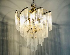 a chandelier hanging from the ceiling in a room