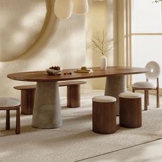 a dining room table with four chairs around it