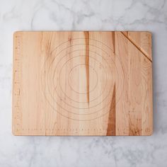 a wooden cutting board with a knife on it