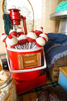 a bucket filled with candy sitting on top of a table