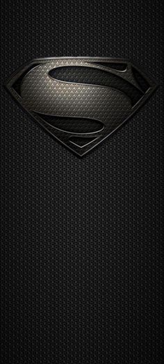 the superman symbol is shown in black and silver on a textured wallpaper background