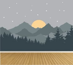 an empty room with wood flooring and mountains in the background