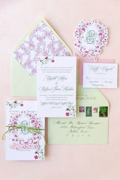 the wedding stationery was done in pink and green