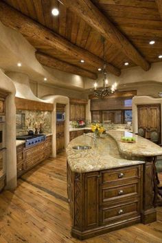 a large kitchen with an island in the middle