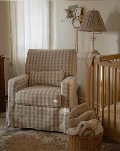 a baby's room with a rocking chair and crib