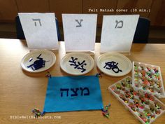 the table is set up with plates and place mats to spell out numbers for hanukkah