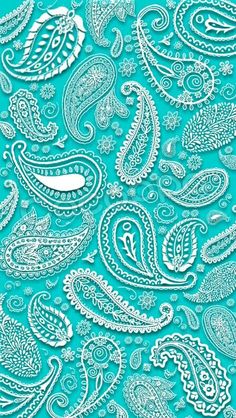 a blue and white paisley pattern on a turquoise background, with lots of small details