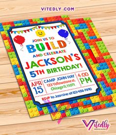 a birthday party with legos on the front and back of it, including a blackboard