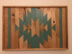 a wooden wall hanging with green arrows on it