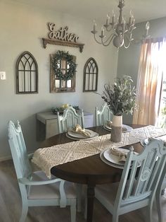 the dining room table is set with place settings