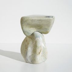 a white marble sculpture sitting on top of a table