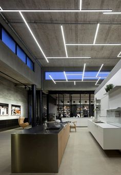 a large open space with modern furniture and lighting