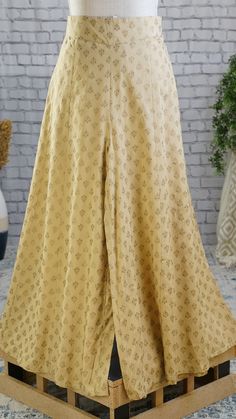 **Product color may have slight variations due to surrounding light** PRODUCT DETAILS A pair of Beige printed woven flared fit Palazzos, opaque, 1 pockets, and slip-on closure Size & Fit Small: 30 inches (expandable upto 36 inches) Medium: 32 inches (expands upto 38 inches) Large: 34 inches (expands upto 40 inches) X-Large: 36 inches (expands upto 42 inches) XX-Large: 38 inches (expands upto 44 inches) Length: 38 inches Material & Care Liva Hand-wash Specifications Occasion Ethnic Fit Fl Fitted Wide Leg Palazzo Set For Spring, Spring Wide Leg Fitted Palazzo Set, Traditional Fitted Ankle-length Palazzo Set, Festive Full-length Palazzo Set, Fitted Festive Trousers, Festive Fitted Ankle-length Pants, Festive Fitted Ankle-length Sets, Fitted Cotton Set With Long Skirt, Fitted Wide Leg Palazzo Set For Party