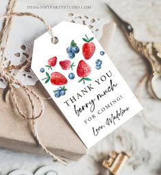 a thank you card with strawberries and blueberries on it next to some scissors