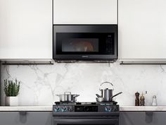 a stove top oven sitting inside of a kitchen