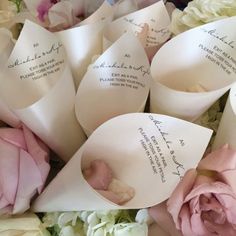 a bunch of flowers that are sitting next to each other with some writing on them