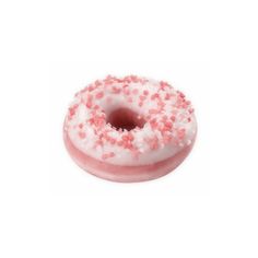 a pink donut with white frosting and sprinkles sitting on a white surface