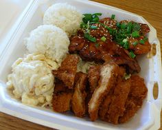 a plastic container filled with meat and rice