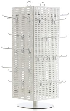 a white wall mounted rack with hooks on the top and two rows of holes in it