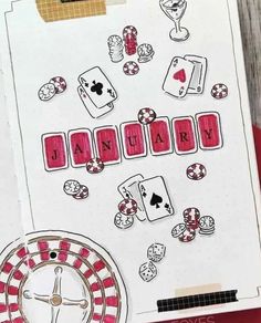 the word january is spelled in red and black letters on a white paper with playing cards