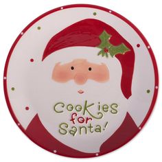 a santa clause plate with cookies for santa written on the front and green lettering on the back