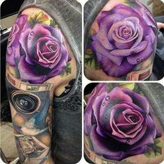 a purple rose tattoo on the left arm and half sleeve, with other tattoos around it