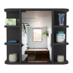 an open bathroom with shelves holding various items