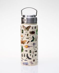 a stainless steel water bottle with butterflies and bugs on the front, sitting on a white surface