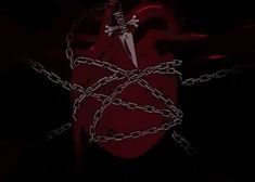 a red heart with chains attached to it and a knife stuck in the middle, on a black background