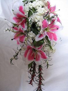 a bridal bouquet with pink and white flowers