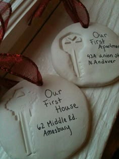 two white rocks with writing on them that say, make a safe dough imprint of the keys to your first apartment and first house to save as an awesome keepsake