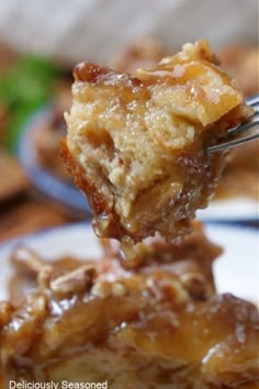 a close up of a fork with food on it