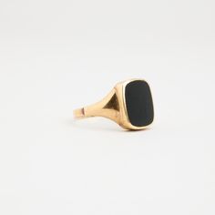 R I N G WITH BLACK ONYX ∙  * Details: Solid Gold ∙ 14K Gold ∙ Yellow Gold * Stones: black onyx * Weight: 4.64 grams * Ring size: 12¼ * Condition: All our pieces are vintage, antique or close to new. The piece undergoes a restoration proces, which includes ultrasonic cleaning and mild polish techniques to enhance the condition of the piece. * All our pieces are vintage and handpicked. We put a lot of effort into finding the most unique and beautiful items for you guys ♥️ Hope you like it A U T H Black Minimalist Signet Ring With Polished Finish, Minimalist Black Signet Ring With Polished Finish, Black Minimalist Signet Ring For Everyday, Everyday Black Signet Ring With Polished Finish, Minimalist Black Tarnish Resistant Rings, Minimalist Black Tarnish-resistant Rings, Modern Black Tarnish Resistant Signet Ring, Modern Black Tarnish-resistant Signet Ring, Black Tarnish Resistant Signet Ring For Formal Occasions