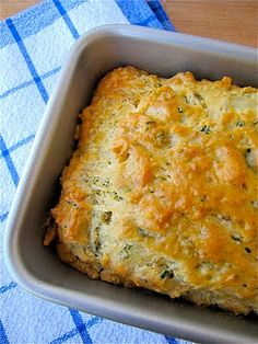 a casserole in a pan on a blue and white towel