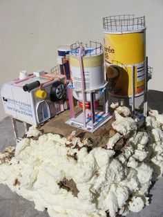 a pile of white stuff sitting on top of a table next to two buckets