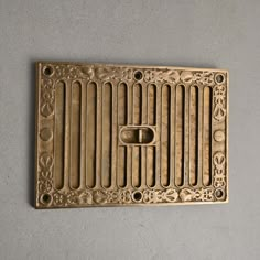 a metal grate with decorative designs on it