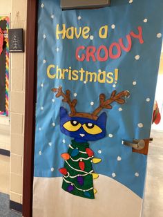 a door decorated with a christmas tree and an angry bird on it's side