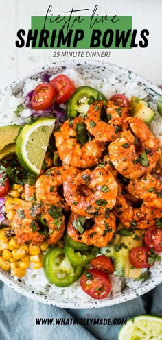 shrimp and corn salad with limes, tomatoes, cucumber, avocado, and cilantro in a white bowl