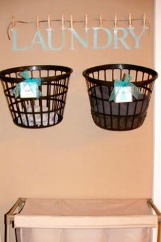 two laundry baskets are hanging on the wall