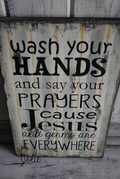 a sign that says wash your hands and say your prayer