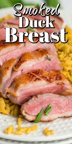 sliced duck breast on a plate with corn