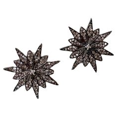 These gorgeous vintage diamond starburst earrings feature a starburst motif (also resembling a spider web) with dozens of individual diamonds creating a magnificent glowing effect. The "blackened gold" look gives these a Victorian feeling. They are set in solid sterling silver, containing .68 karats of diamonds. Finished with a post back, and measures about 11 mm diameter. The Vintage 1970s Halter Dress pictured is also available. Great vintage condition. With any questions about the specific co Glowing Effect, Starburst Earrings, Dress Picture, Vintage Diamond, Spider Web, Vintage 1970s, Jewelry Earrings Studs, New Vintage, Halter Dress