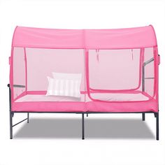 a pink playpen with two pillows on it