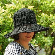 * Adult One size; Fits head circumference 22"/ 54 cm and up (contact us for custom colors/sizes). D E S C R I P T I O N *Get stylish with the most comfortable, durable summer hat you will ever own. Hand crocheted with a sustainable cotton and raffia blend this lightweight sun hat features an adjustable wire brim to fit any style and a detachable cotton sunflower pin to showcase your earth friendly vibe!  *  The optional, high quality satin lining adds protection for all hair types and the crown Spring Beach Cloche Hat One Size, Black Cloche Hat For Beach, Black One Size Cloche Hat For Beach, Black Cloche Hat For Kentucky Derby And Beach, One Size Cloche Hat For The Beach, Black Cloche Hat For Beach In Spring, One Size Beach Cloche Hat With Short Brim, One Size Short Brim Cloche Hat For Beach, Handmade Black Crochet Hat For Beach